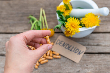 Naklejka premium Dandelion extract and homeopathic supplements. Selective focus.