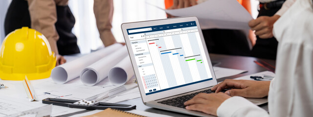 Project planning software for brisk business project management on the computer screen showing...