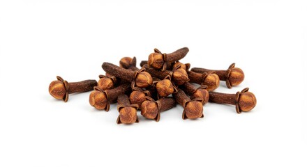 Dried cloves arranged in a pile on a white background  