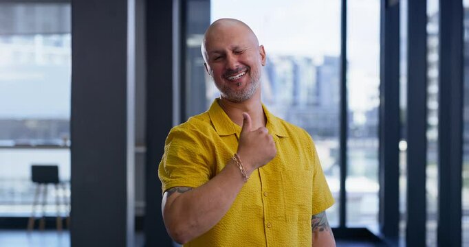 Happy creative, businessman or feedback with thumbs up for positive review or vote at office. Portrait, male person or employee designer with smile, like emoji or yes sign for OK, good job or opinion