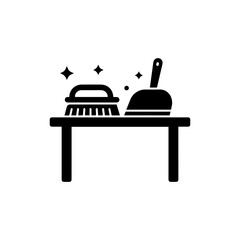 Black Icon of a Brush and Dustpan on a Table