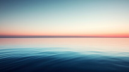Obraz premium Serene sunset over calm ocean water.