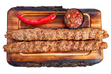 Grilled kebabs served with spicy salsa and fresh chili