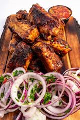 Succulent grilled ribs served with fresh onions and salsa
