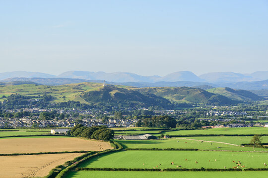 The view from Birkrigg across the town of Ulverston and the Cumbrian fells beyond