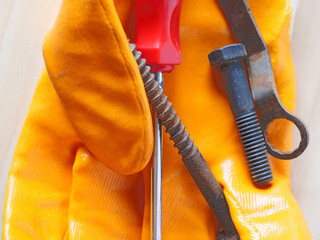 close-up repair tools on work gloves
