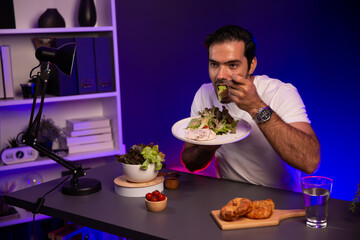 Healthy influencer in host channel tasting chicken meat ingredient health on diet life in mixed salad for easy cooking product by self with tasty food on social media live on meal time. Surmise.