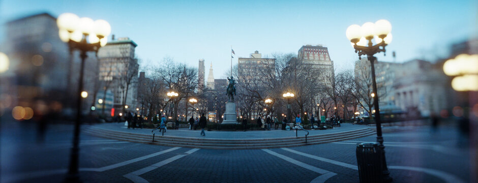 Panoramic view of lampposts lit up at town square, Union Square, New York City, New York State, USA.