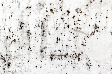 Abstract weathered wall texture with dark spots on white surface