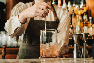 Closeup of Bartender Stirring Chilled Cocktail