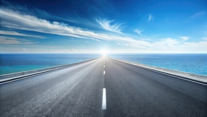Fototapeta premium Asphalt road stretching towards a bright horizon over tranquil ocean waters under a vibrant sky