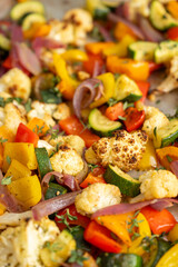 Close up of Roasted Vegetable Salad with Fresh Herbs and Sprouts