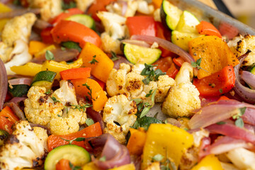 Close up of Roasted Vegetable Salad with Fresh Herbs and Sprouts