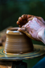 Hands Shaping Clay on a Pottery Wheel – Artisan Craftsmanship Close-Up..