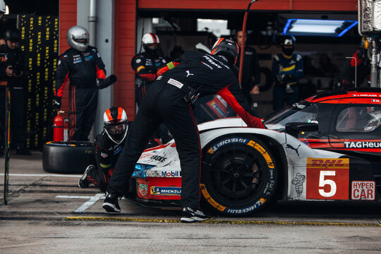 Porsche 963 Penske LMDh at the pitlane during tyre change