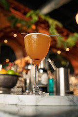 Craft Cocktail on Marble Bar with Cherry Garnish