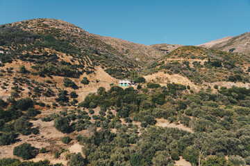 A single building on the slopes of the mountains located in western Crete