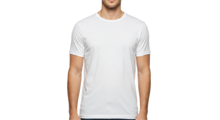 A man wearing a plain white t shirt standing against a black background in a studio setting shot frontally