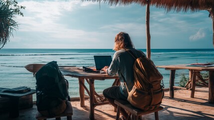 A digital nomad working remotely on a laptop from a tropical beachside caf&eacute; surrounded by palm trees and ocean views, embodying the freedom lifestyle