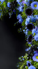 Full of blue mixture of flowers, blooming sunflowers, daisies, tiny stems and branches, vertical floral arrangement on black backdrop 