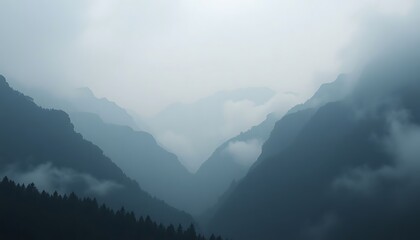 Naklejka premium view of a mountain range in the fog