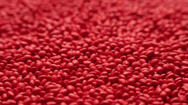 Red polymer dye in granules, background texture