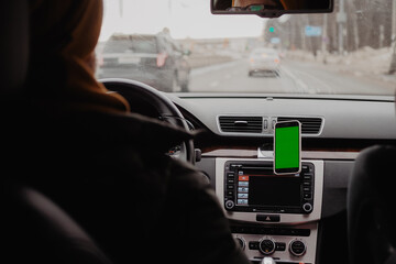 Man drive the car and using mobile app , green screen