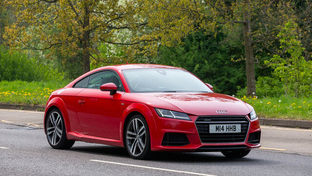 Milton Keynes,UK - Apr 26th 2025: 2016 red Audi tt car driving on a British road