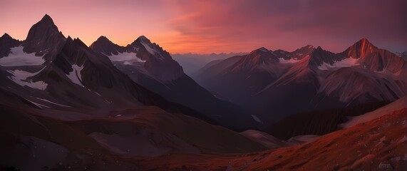 Sunset paints sky in deep orange and pink hues above jagged mountain peaks and quiet alpine valley
