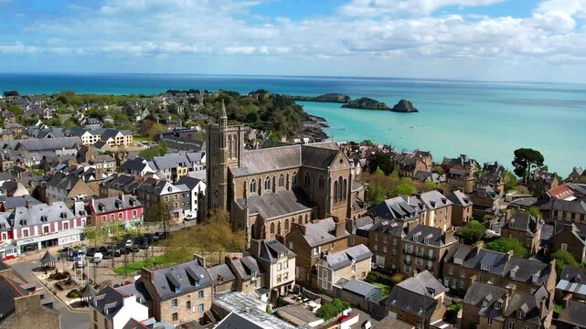 France travel, most scenic traditional villages in Brittany - beautiful Cancale, famous for oysters and turquoise sea. High angle drone 4k hd video