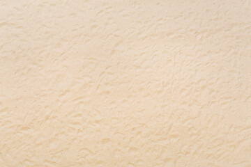 Textured beach sand as background, top view