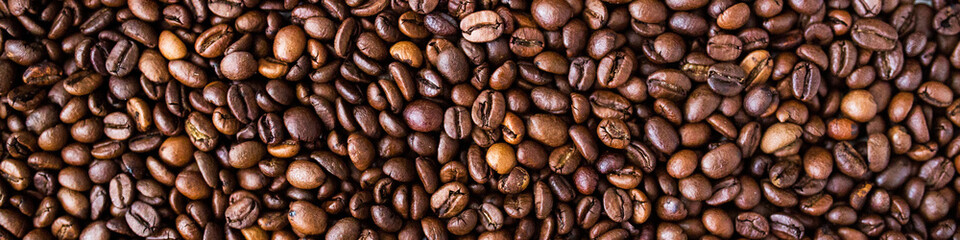 LinkedIn Banner Close-up view of roasted coffee beans, rich in texture and warm brown tones.