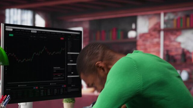 African american investor feels frustrated and sad after losing his stocks, going into bankruptcy and losing all his financial assets. Distraught man experiencing a monetary setback. Camera A.
