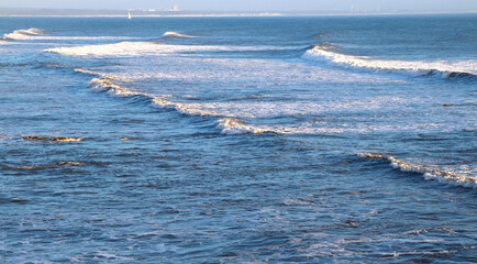 A raging ocean. Waves on the horizon. The appearance of foam. A refreshing landscape. Open space....
