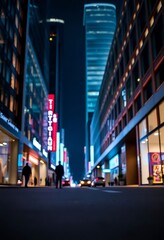 city street at night with tall buildings