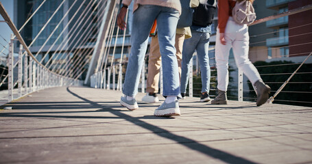 Feet, college and friends with people and walking for education, learning and knowledge. University, academy and youth development with students on campus for scholarship, school and studying