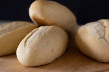 Freshly Baked Bread Rolls on a Wooden Surface