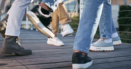 Dance, celebration and music with feet of people for excited, hip hop and artist performance. Freedom, creative and urban with closeup of group of dancers in city for energy, summer and talent