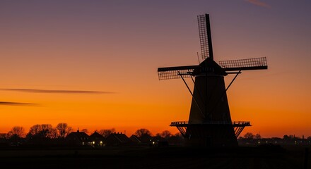 Windmill Silhouette at Colorful Sunset Rural Landscape
