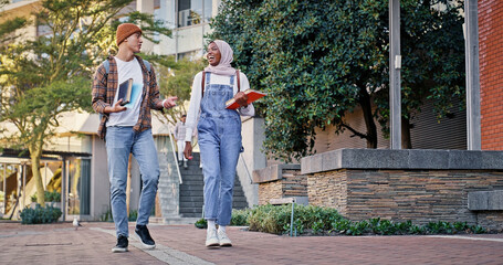 Fototapeta premium University students, outdoor and walking to class together, talking and share knowledge on module. People, friends and outside for project discussion, learning and books for education assignment