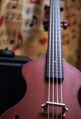 Fototapeta premium close up of a bass guitar on a table