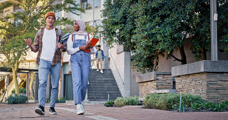 Obraz premium Muslim, friends or students walking in college to class for learning, future or studying in university. Diversity, outdoor or young people with book or knowledge for school, education or scholarship