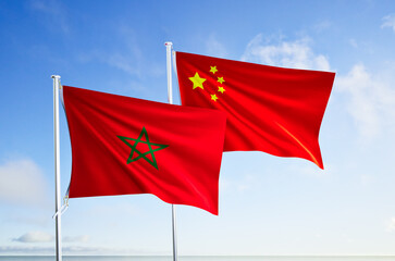 flags of morocco and china over blue sky background.