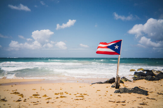 Puerto Rican flag next to the ocean in San Juan 