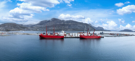 International shipping line transportation container cargo ship in Nuuk Port in Greenland © eskystudio