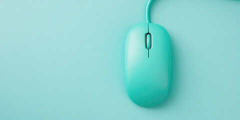 A teal computer mouse with a sleek design sits on a matching monochromatic surface. The cable extends upward, aligned symmetrically. The scroll wheel and buttons are visible