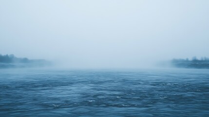 Fototapeta premium Mystical seascape with ethereal fog rolling over the rippling water