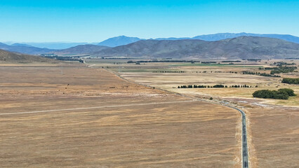 Remote rural arid desert like valley McKenzies Pass near Dog Kennel corner Tekapo