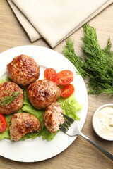 Delicious patties served on wooden table, flat lay