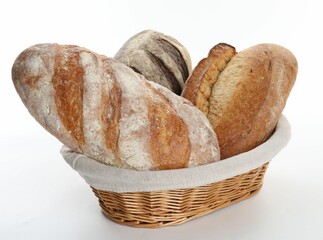 Different loaves of fresh bread in basket isolated on white